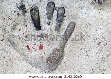 Handprint in the old gray concrete slab