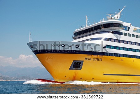 Ajaccio, France - June 30, 2015: Mega Express ferry, big yellow passenger ship operated by Corsica Ferries Sardinia Ferries shipping company, bow fragment