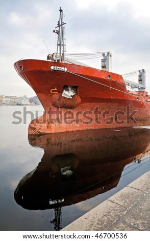 Bulbous bow design detail on moored trader ship. Russia, Saint-Petersburg, Neva river, Leytenanta Shmidta embankment.