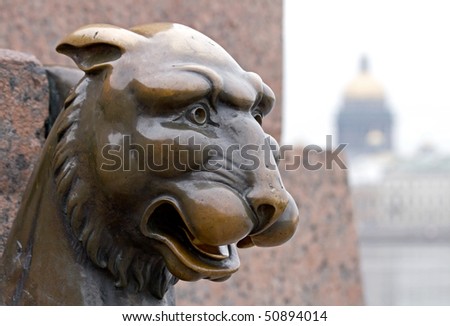 Griffin - bronze winged lions on the University Embankment in front of the Academy of Arts. St. Petersburg. Russia