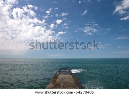 Concrete pier on Black Sea coast. Russia, Sochi, Adler.