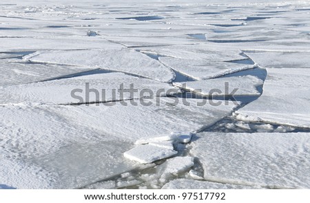 Blocks of ice on frozen lake. Background texture