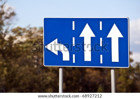 Three-lane traffic sign, left turn and straight arrows.