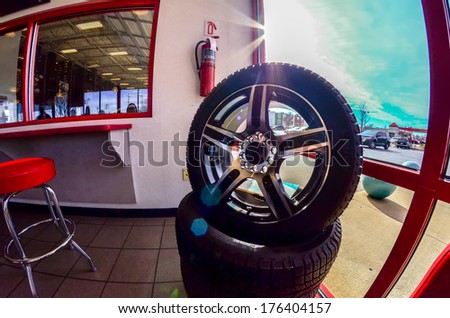 car tires on display for sale at a tire shop store