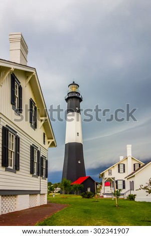 tybee island beach lighthouse with thunder and lightning