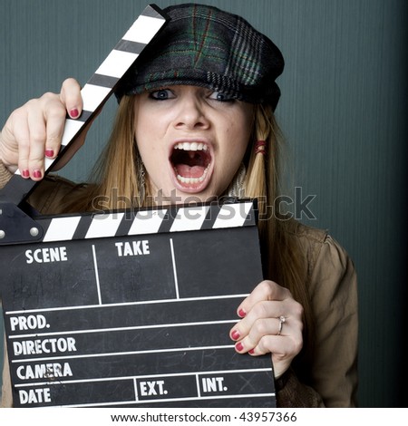 Young Female Director with slate