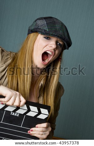 Young Female Director with slate yelling