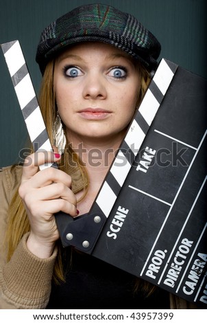 Young Female Director with slate