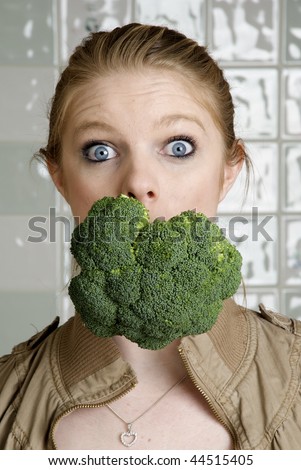 Fun Food, Healthy Eating, Woman with broccoli in her mouth