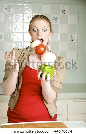 Healthy Balanced Diet, Woman balancing vegetables in the kitchen