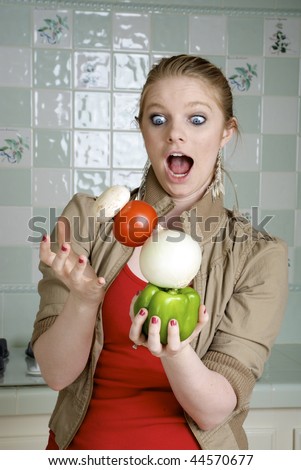 Healthy Balanced Diet, Woman balancing vegetables in the kitchen