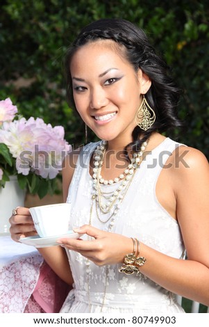 Beautiful Yong Asian Woman at a Tea Party
