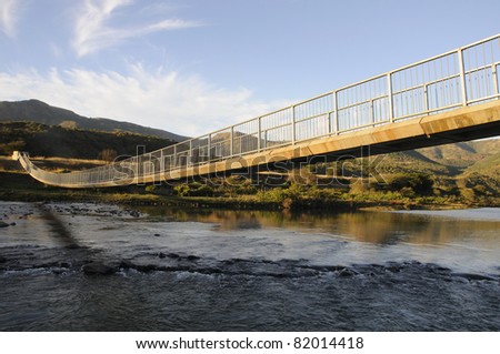 stock photo : A pedestrian bridge over flood prone river in KZN South Africa
