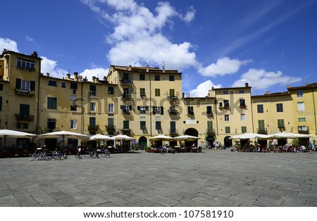 LUCCA, ITALY - JUNE 11: the square of Piazza dell\'Anfiteatro was built on the ruins of the ancient Roman amphitheatre and is one of the landmarks in the medieval city on June 11, 2012 in Lucca, Italy