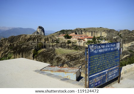 KALAMBAKA, GREECE - SEPTEMBER 29: Clothing regulations and opening hours of the monastery Holy Trinity (in background), a Unesco World Heritage site, on September 29, 2012 in Kalambaka, Greece