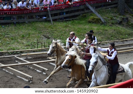 SEIS, ITALY - JUNE 16: Unidentified actors and spectators by yearly horse-riding event named 