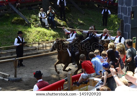 SEIS, ITALY - JUNE 16: Unidentified actors and spectators by yearly horse-riding event named 
