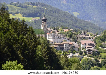 Italy, church and homes in Voels am Schlern (Fie Allo Sciliar)