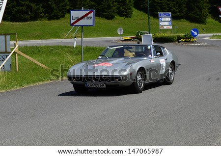 LUNZ, AUSTRIA - JULY 19: Maserati Ghibli on special stage by International Ennstal Classic 2013, a yearly tournament through Austria for vintage cars on July 19, 2013, in Lunz am See, Austria