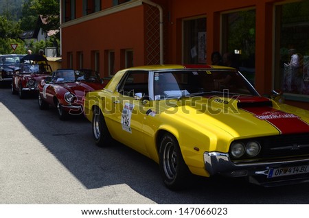 LUNZ, AUSTRIA - JULY 19: Different cars on special stage by International Ennstal Classic 2013, a yearly tournament through Austria for vintage cars on July 19, 2013, in Lunz am See, Austria