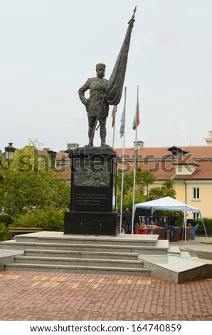 SOFIA, BULGARIA - SEPTEMBER 28: Monument of the Bulgarian volunteers and small second hand market in the park, on September 28, 2013 in Sofia, Bulgaria