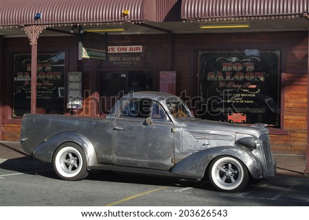 ALICE SPRINGS, AUSTRALIA - APRIL 16: Unidentivied vintage car and bar- restaurant in the city in Australians outback, Northern Territory, on April 16, 2010 in Alice Springs, Australia
