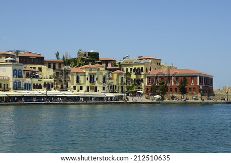 CHANIA, GREECE - MAY 27: Unidentified people and different restaurants, shops and hotels along the harbor of the medieval village in Crete, on May 27, 2014, in Chania, Greece