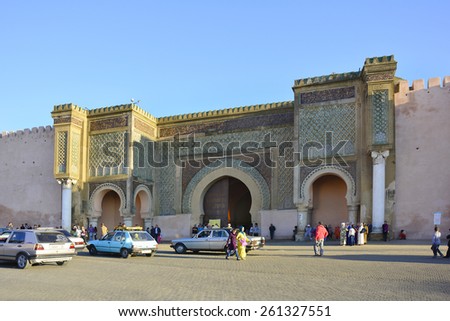 MEKNES, MOROCCO - NOVEMBER 19: Unidentified people in front of impressive Bab el-Monsour gate, a tourist attraction and landmark of the city, on November 19, 2014 in Meknes, Morocco