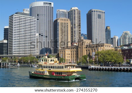 SYDNEY, AUSTRALIA - MAY10: Ferry boat arrive Circular quay, the transportation hub for ship, bus and train, skyline with different buildings behind , on May 10, 2010 in Sydney, Australia