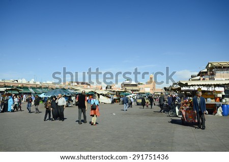 MARRAKESH, MOROCCO - NOVEMBER 22:: Unidentified people and shops on Djemaa el-Fna, tourist attraction and Unesco World Heritage site, on November 22, 2014 in Marrakesh, Morocco