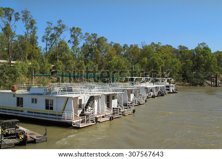 ECHUCA, AUSTRALIA - JANUARY 21: Rentable house boats on Murray river, a preferred mode of transport for vacation on the largest river of Australia, on January 21, 2008 in Echuca, Australia