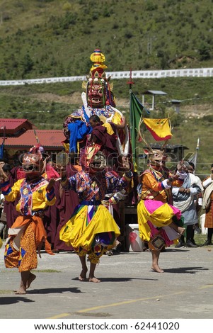 HAA, BHUTAN - SEPTEMBER 21: unknown spectators and dancers by religious festival named Tshechu in Haa, Western Bhutan, in the White Temple on September 21, 2007 in Haa Village in Bhutan