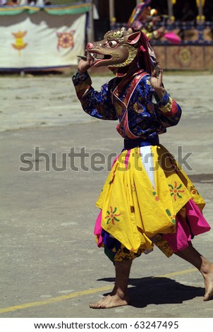 HAA, BHUTAN - SEPTEMBER 21: unknown spectators and dancers with masks at the religous festival named Tshechu in the White Temple (Karpho Lhakhang) on September 21, 2007 in Haa, Bhutan