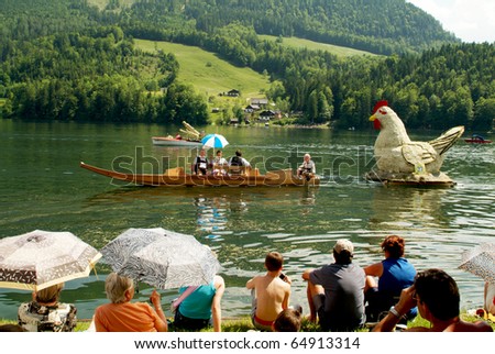 BAD AUSSEE, AUSTRIA - MAY 30: unidentified people on boats with flower figures by  Narcissus Festival on the Grundlsee-LakeMay 30, 2005 in Bad Aussee, Styria, Austria