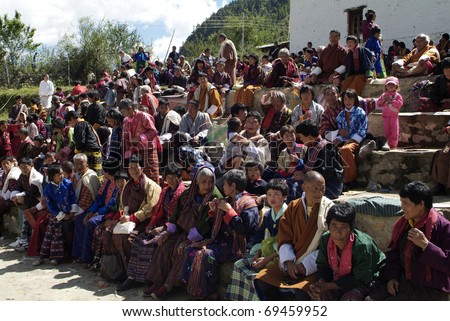 HAA-VALLEY, BHUTAN - SEPTEMBER 21: unidentified spectators by religious festival named Tshechu in Haa, in the White Temple (Karpho Lhakhang) on September 21, 2007 in Haa-Valley, Bhutan