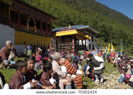 HAA-VALLEY, BHUTAN - SEPTEMBER 21: unidentified spectators by religious festival named Tshechu in Haa, in the White Temple (Karpho Lhakhang) on September 21, 2007 in Haa-Valley, Bhutan