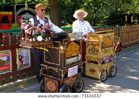 VIENNA, AUSTRIA - SEPTEMBER 02: unidentified musicians with their barrel organs  in the yearly meeting for organ grinders in the Bohemian Prater on September 02, 2006 in Vienna, Austria