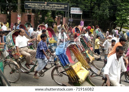 DHAKA, BANGLADESH - SEPT 17: unidentified people in rickshaws, public transportion vehicles on September 17, 2007 in Dhaka, Bangladesh.
