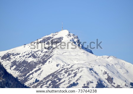 Austria, winter in Tirol with Kitzbueheler Horn (mountain summit) with TV transmitting station