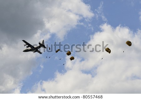 ZELTWEG, AUSTRIA - JULY 01: para troops jumping from a Hercules C 130 of the Austrian airforce by airshow - airpower11 - on July 01, 2011 in Zeltweg, Austria