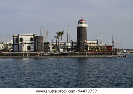 Playa Blanca, Spain - January 15th 2012: marina Rubicon with Bar One and yachts in the village Playa Blanca. Canary Islands are a favorite winter destination for Europeans