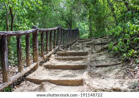 Old Stone staircase with wood railing in jungle, Kanchanaburi,Thailand
