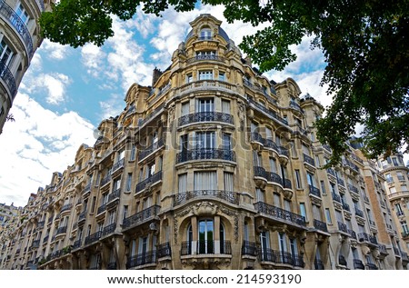 Facade of typical house with balcony in Paris. City, urban view on building in Paris, France