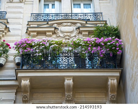 Facade of typical house with balcony in Paris, France