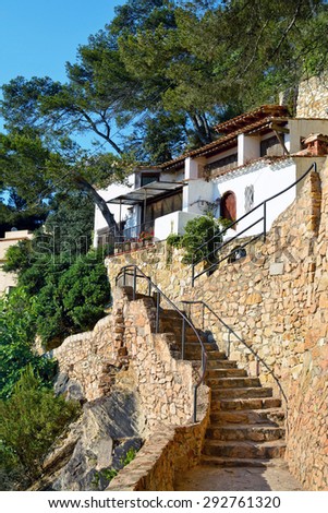 Old stone ladder leading to the house in the village in the mountains, Catalonia, Spain