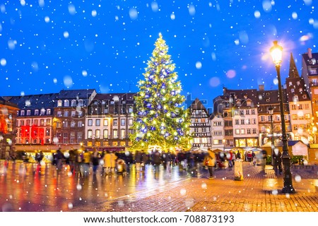 Christmas tree and xmas market at Kleber Square at night  in medieval city of Strasbourg - capital of Noel, Alsace, France.