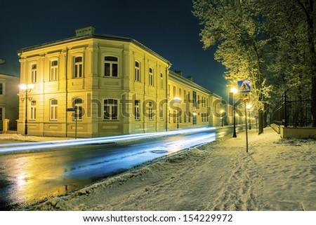 Street in Siedlce, Poland covered with snow at night