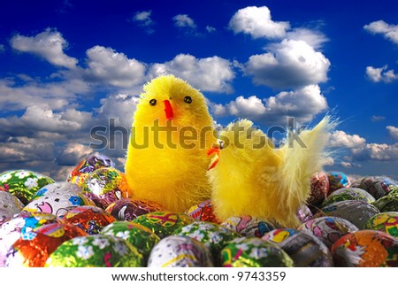 Chocolate Easter eggs and a toy chickens