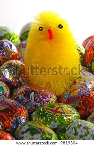 Chocolate Easter eggs and a toy chicken