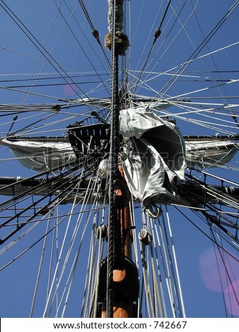 An interesting pattern from ropes on a ship\'s mast.